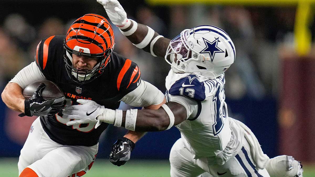 Cincinnati Bengals tight end Mike Gesicki (88) tries to break free from Dallas Cowboys linebacker DeMarvion Overshown (13) during the first half Monday Night Football at AT&T Stadium in Arlington, Texas on Monday, December 9, 2024.