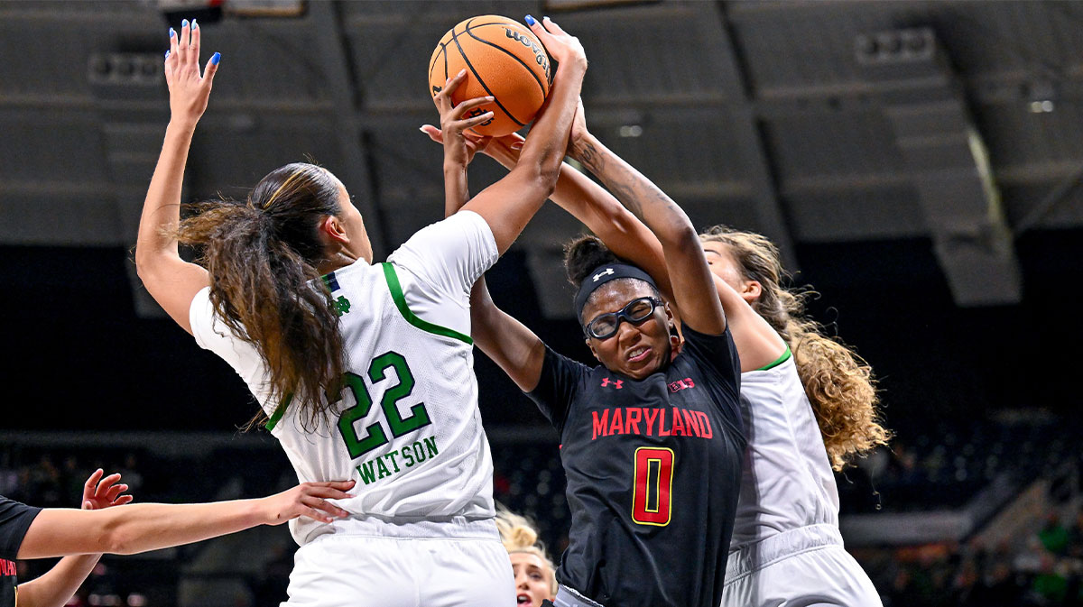 Dec 1, 2022; South Bend, Indiana, USA; Notre Dame Fighting Irish forwards Kylee Watson (22) and Maddy Westbeld (21) battle for a rebound against Maryland Terrapins guard Shayne Sellers (0) in the first half at the Purcell Pavilion. Mandatory Credit: Matt Cashore-Imagn Images