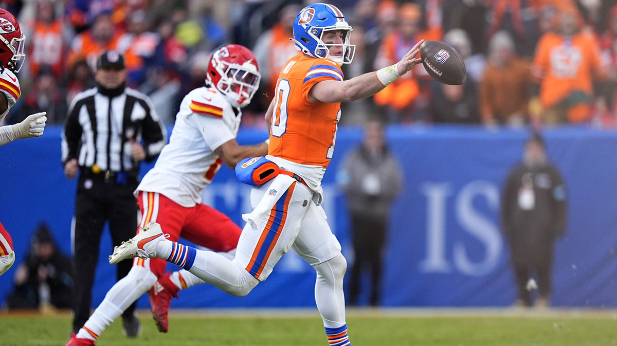 Denver Broncos quarterback Bo Nix (10) laterals the ball in the second quarter against the Kansas City Chiefs at Empower Field at Mile High.