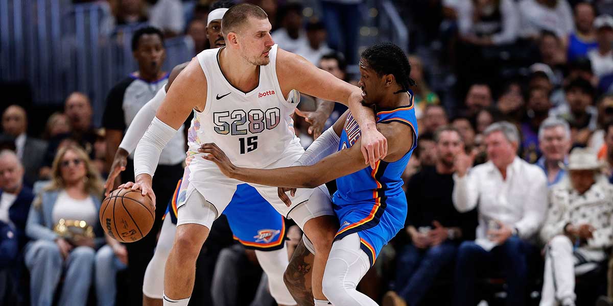 Denver Nuggets center Nikola Jokic (15) controls the ball as Oklahoma City Thunder forward Jalen Williams (8) guards in the second quarter during game six of the second round for the 2025 NBA Playoffs at Ball Arena.