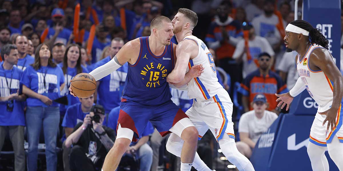 Denver Nuggets center Nikola Jokic (15) drives against Oklahoma City Thunder center Isaiah Hartenstein (55) during the second half of game five of the second round for the 2025 NBA Playoffs at Paycom Center.