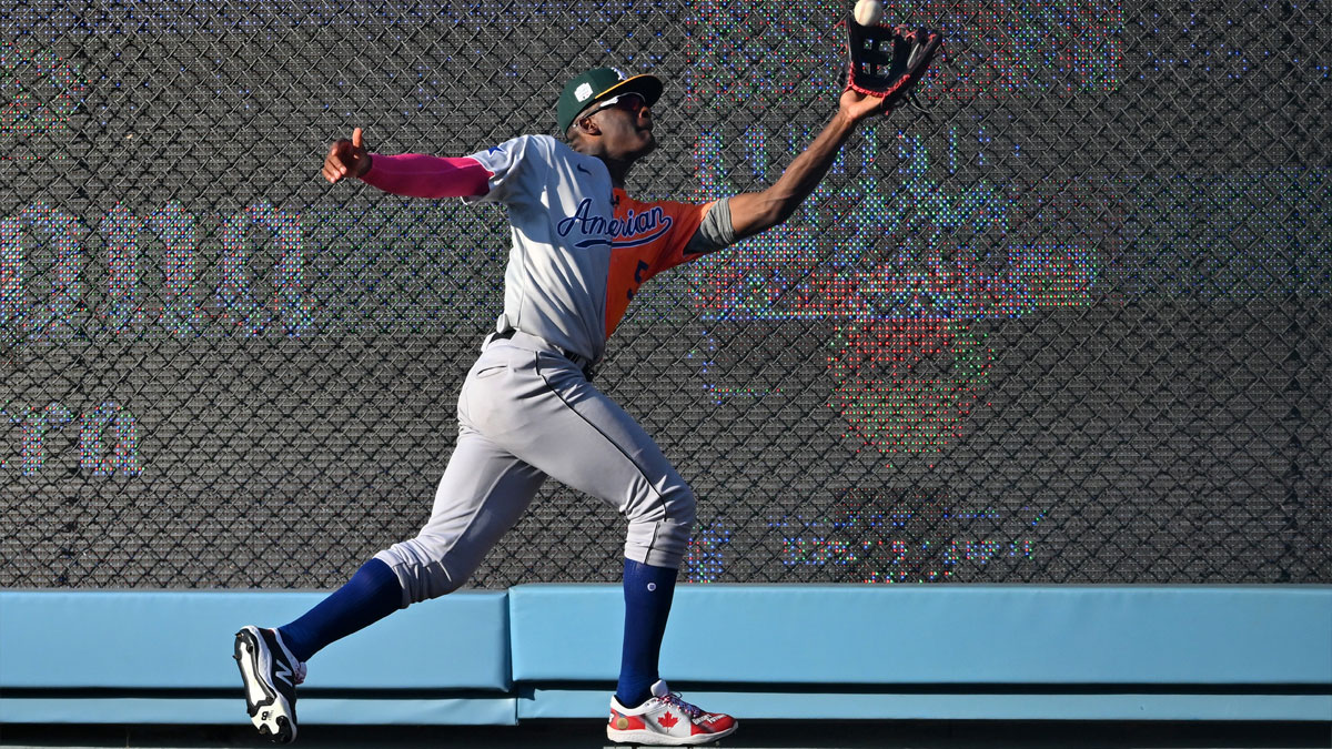 American League Futures right fielder Denzel Clarke (5) makes a catch at the wall on a ball hit by National League Futures catcher Diego Cartaya (not pictured) in the seventh inning of the All Star-Futures Game at Dodger Stadium.