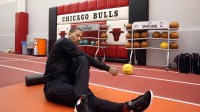 Chicago Bulls point guard Derrick Rose stretches as he rehabs from an ALC injury at the Berto Center.