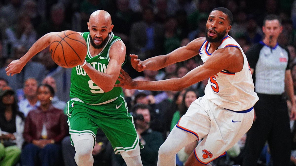 Boston Celtics guard Derrick White (9) and New York Knicks forward Mikal Bridges (25) work for the ball in the second quarter during game two of the second round for the 2025 NBA Playoffs at TD Garden.