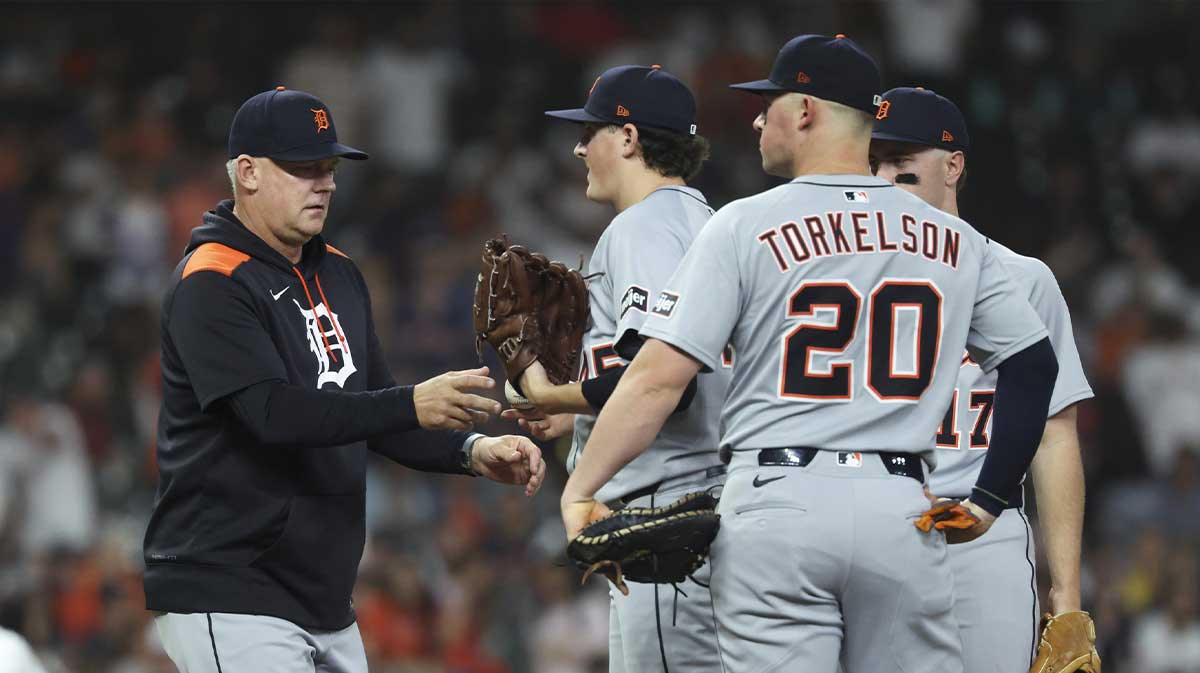 Detroit Tigers manager A.J. Hinch (14) takes the ball from starting pitcher Reese Olson (45) during a pitching change in the sixth inning against the Houston Astros at Daikin Park.