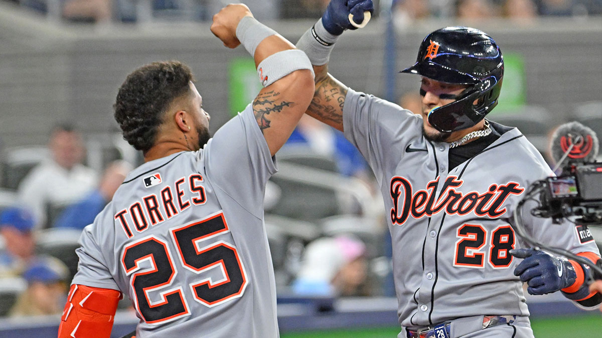 Detroit Tigers center fielder Javier Baez (28) is greeted by second baseman Gleyber Torres (25) after hitting a solo home run against the Toronto Blue Jays in the eighth inning at Rogers Centre.