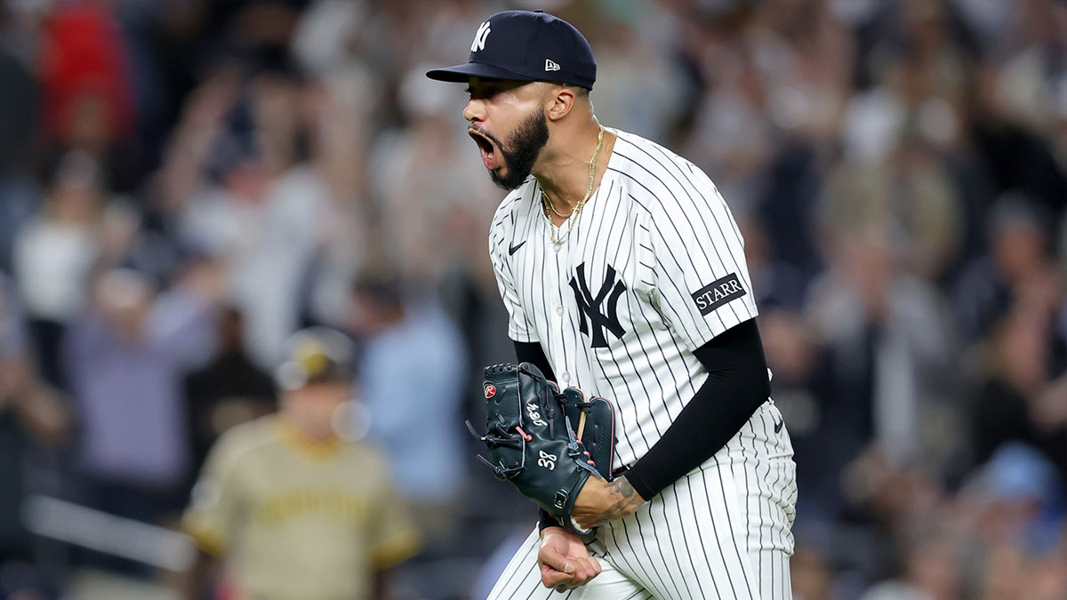 New York Yankees relief pitcher Devin Williams (38) reacts after the top of the tenth inning against the San Diego Padres at Yankee Stadium.