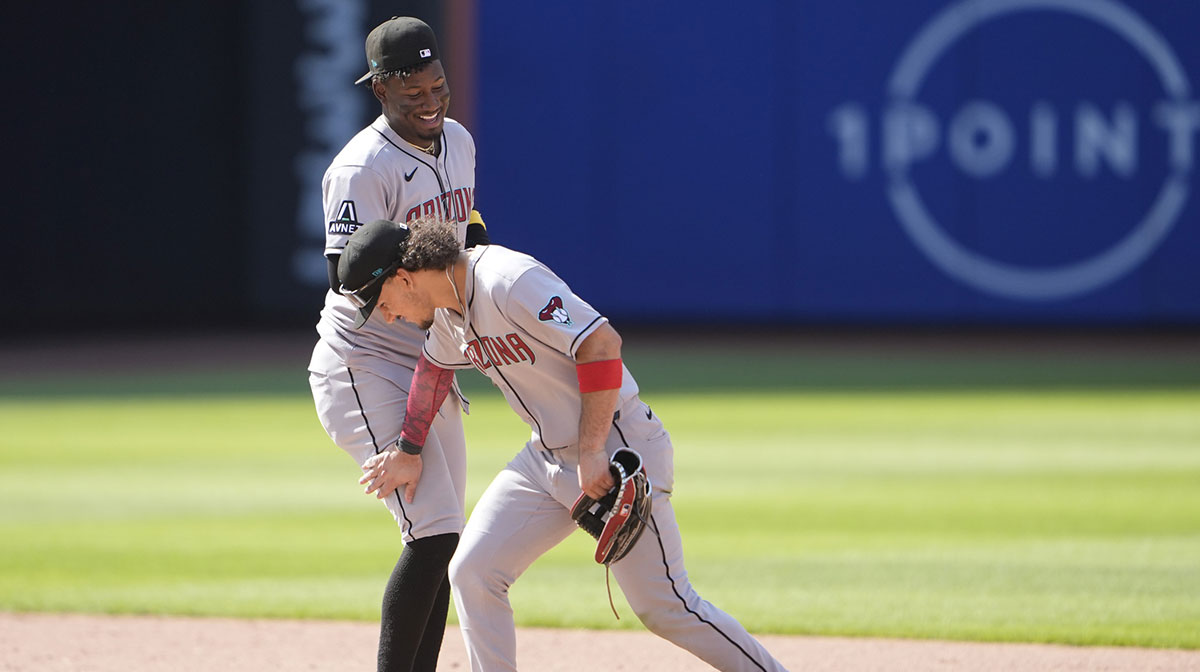 Arizona Diamondbacks center fielder Alek Thomas (5) taps shortstop Geraldo Perdomo (2) on the leg to celebrate the victory against the New York Mets after during the ninth inning at Citi Field.