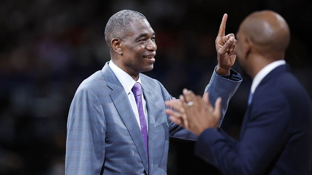 Dikembe Mutombo gestures as he is introduced after the first quarter at Saitama Super Arena.