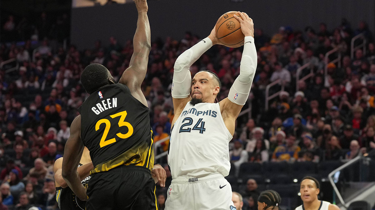 Memphis Grizzlies forward Dillon Brooks (24) handles the ball against Golden State Warriors forward Draymond Green (23) during the fourth quarter at Chase Center.