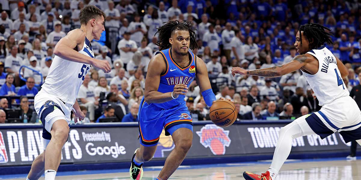 Oklahoma City Thunder forward Dillon Jones (3) drives to the basket against Minnesota Timberwolves center Luka Garza (55) and guard Rob Dillingham (4) during the fourth quarter in game five of the western conference finals for the 2025 NBA Playoffs at Paycom Center. Mandatory Credit: Alonzo Adams-Imagn Images