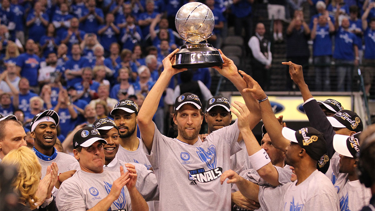 Dallas Mavericks forward Dirk Nowitzki (41) hoist the Western Conference champions trophy after game five against the Oklahoma City Thunder for the Western Conference Finals of the 2011 NBA playoffs at American Airlines Center. The Mavs beat the Thunder 100-96.