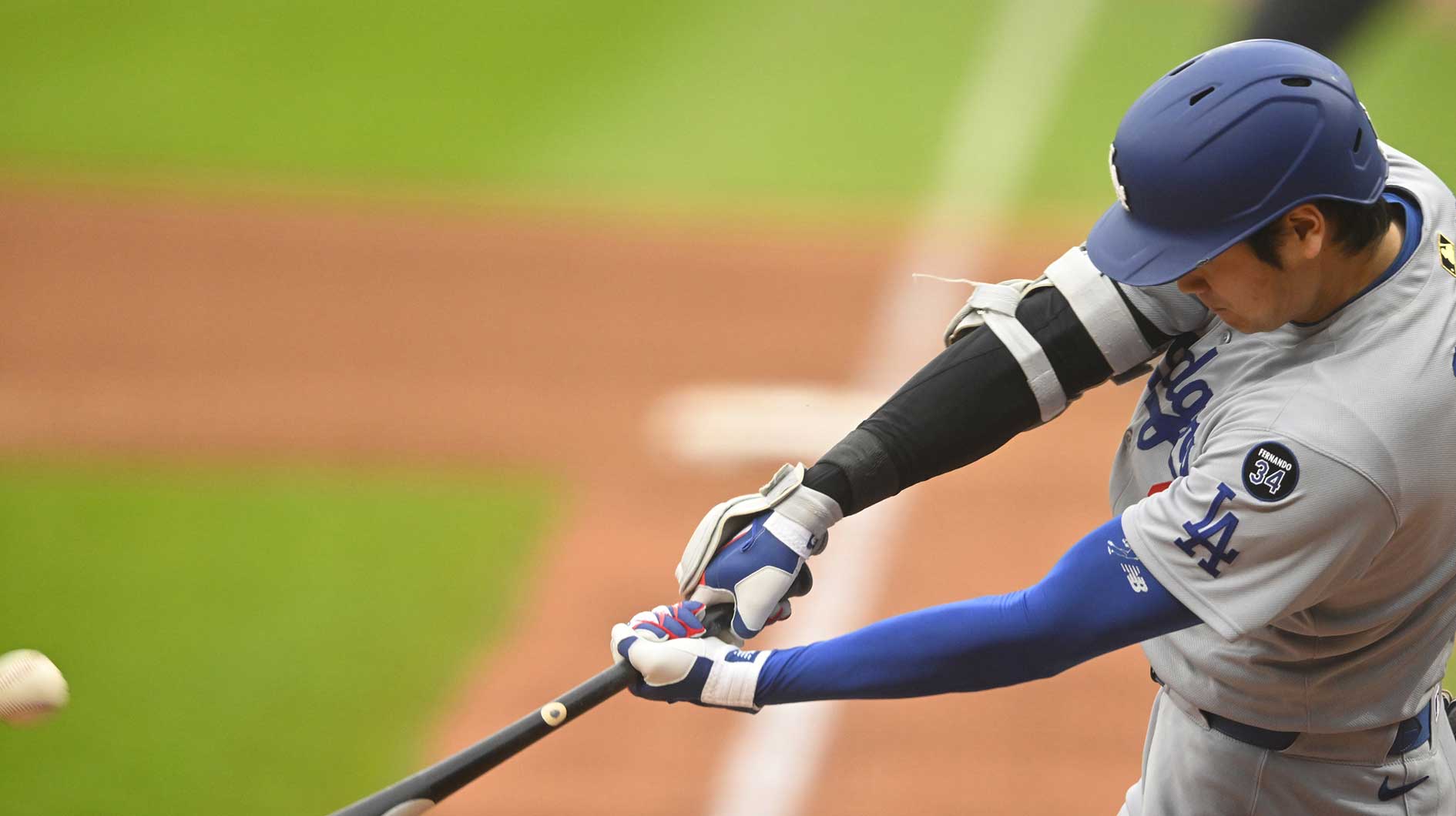 Los Angeles Dodgers designated hitter Shohei Ohtani (17) hits a two-run home run in the fourth inning against the Cleveland Guardians at Progressive Field.