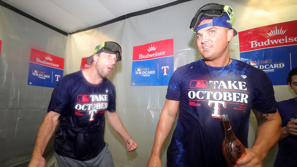 Texas Rangers starting pitcher Max Scherzer (L) and bench coach/offensive coordinator Donnie Ecker (R) celebrate after defeating the Tampa Bay Rays in game two of the Wildcard series for the 2023 MLB playoffs at Tropicana Field. Mandatory Credit: Nathan Ray Seebeck-Imagn Images