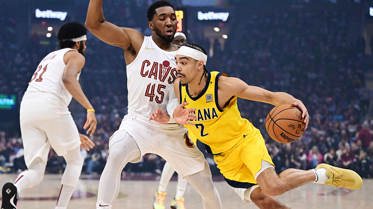 Indiana Pacers guard Andrew Nembhard (2) drives to the basket against Cleveland Cavaliers guard Donovan Mitchell (45) during the first quarter in game one of the second round for the 2025 NBA Playoffs at Rocket Arena.