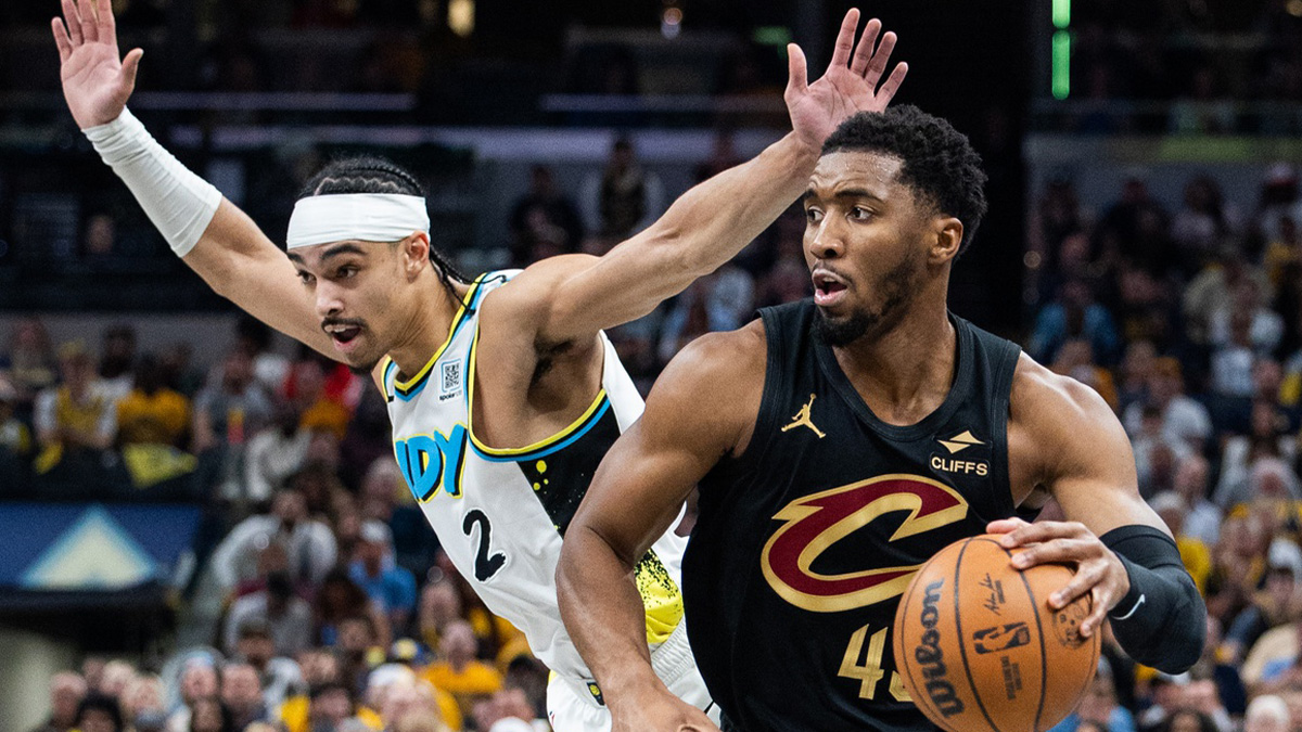 Cleveland Cavaliers guard Donovan Mitchell (45) dribbles the ball while Indiana Pacers guard Andrew Nembhard (2) defends during game four of the second round for the 2025 NBA Playoffs at Gainbridge Fieldhouse.