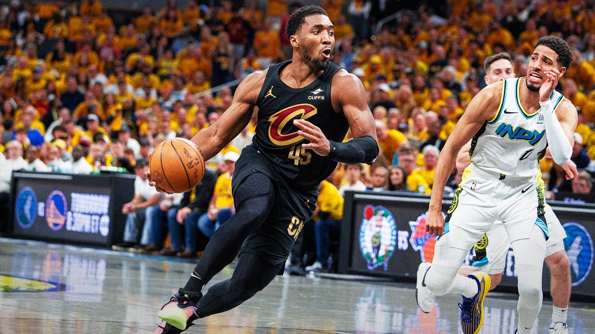 Cleveland Cavaliers guard Donovan Mitchell (45) dribbles the ball while Indiana Pacers guard Tyrese Haliburton (0) defends during game three of the second round for the 2025 NBA Playoffs at Gainbridge Fieldhouse.