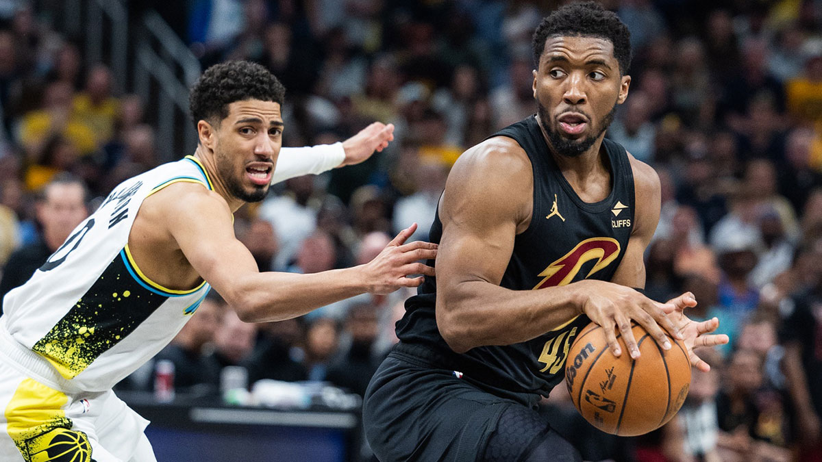 Cleveland Cavaliers guard Donovan Mitchell (45) dribbles the ball while Indiana Pacers guard Tyrese Haliburton (0) defends during game four of the second round for the 2025 NBA Playoffs at Gainbridge Fieldhouse.