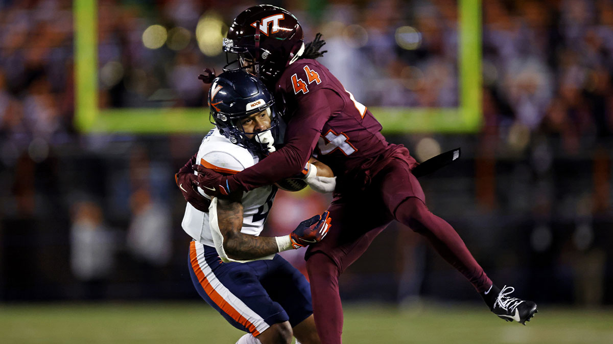 Virginia Tech Hokies cornerback Dorian Strong (44) tackles Virginia Cavaliers wide receiver Chris Tyree (4) during the fourth quarter at Lane Stadium.