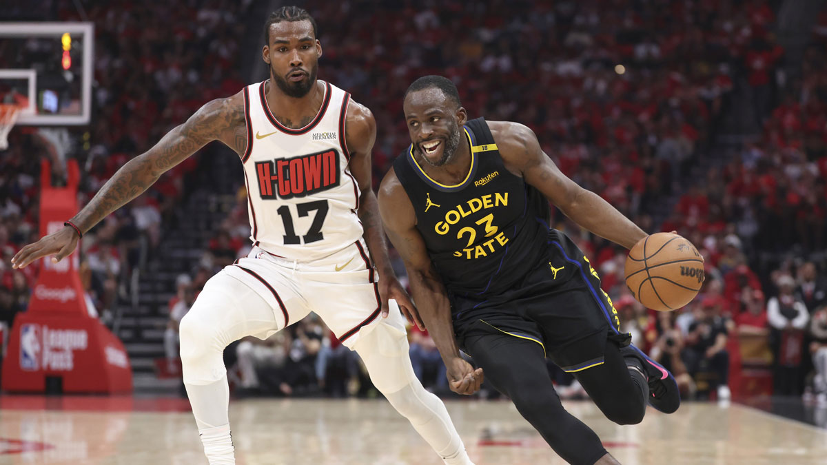 Golden State Warriors forward Draymond Green (23) drives with the ball past Houston Rockets forward Tari Eason (17) to score a basket during the second quarter of game seven of first round for the 2025 NBA Playoffs at Toyota Center.