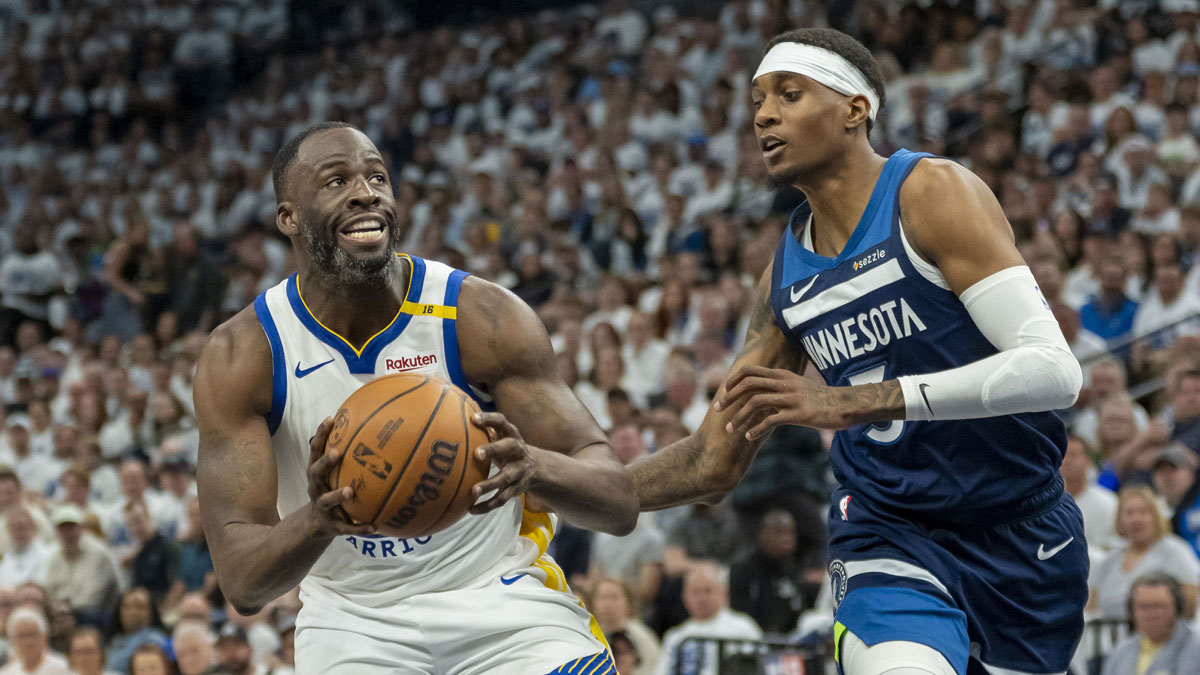 Golden State Warriors forward Draymond Green (23) drives to the basket past Minnesota Timberwolves forward Jaden McDaniels (3) in the second half during game two of the second round for the 2025 NBA Playoffs at Target Center.