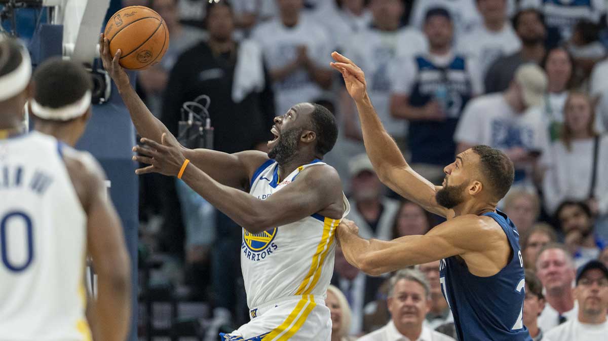 Golden State Warriors forward Draymond Green (23) drives to the basket past Minnesota Timberwolves center Rudy Gobert (27) in the first half during game five of the second round for the 2025 NBA Playoffs at Target Center.