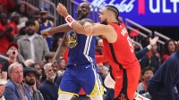Golden State Warriors forward Draymond Green (23) and Houston Rockets forward Dillon Brooks (9) tangle arms during the second quarter during game two of the first round for the 2024 NBA Playoffs at Toyota Center.