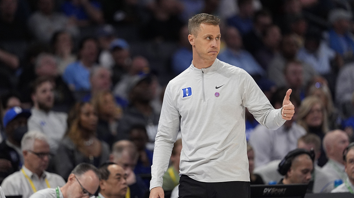 Duke Blue Devils head coach Jon Scheyer gives a thumbs up to his offense against the Georgia Tech Yellow Jackets during the second half at Spectrum Center.