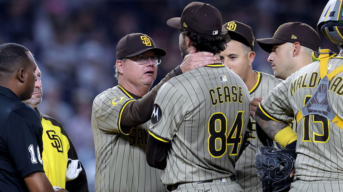 San Diego Padres manager Mike Shildt (8) talks to starting pitcher Dylan Cease (84) before taking him out during the seventh inning against the New York Yankees at Yankee Stadium.