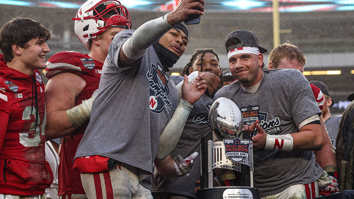 Nebraska Cornhuskers quarterback Dylan Raiola (15) poses for a photo with teammates after the game against the Boston College Eagles at Yankee Stadium.