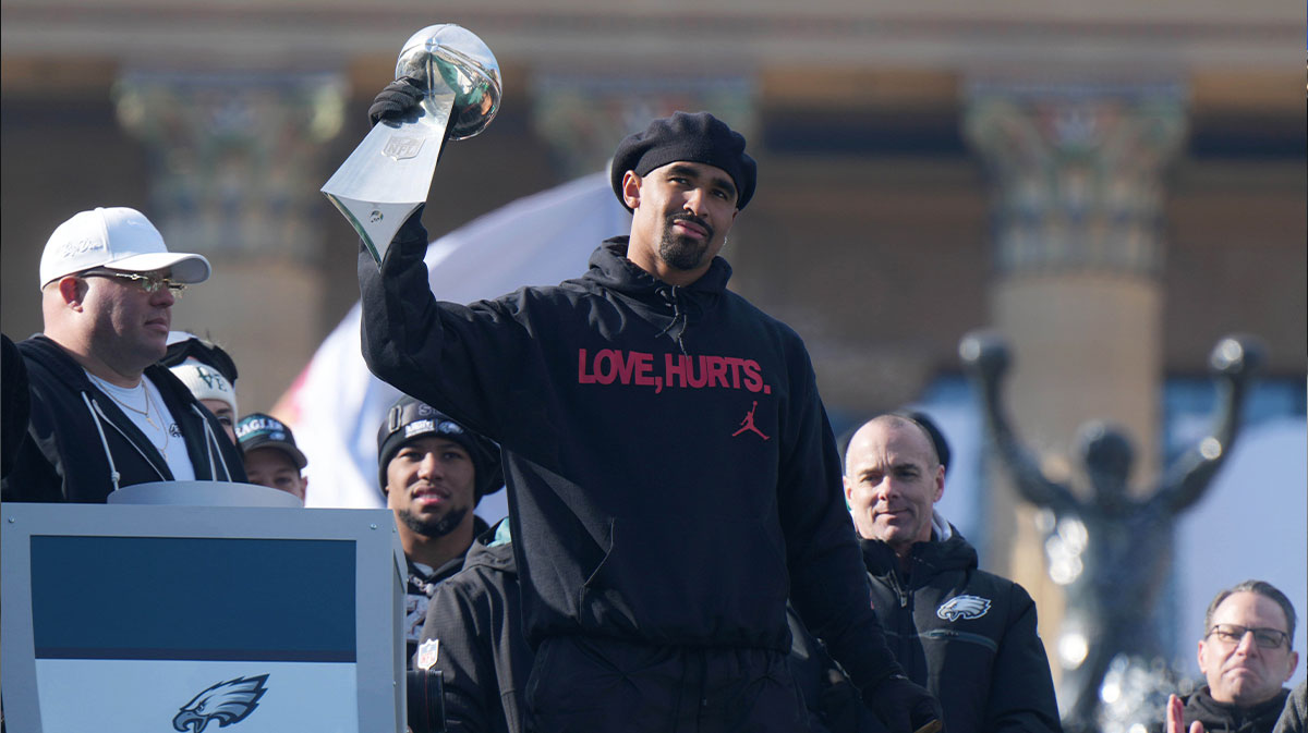 Philadelphia Eagles quarterback Jalen Hurts holds the Vince Lombardi Trophy during the Super Bowl LIX championship parade and rally.