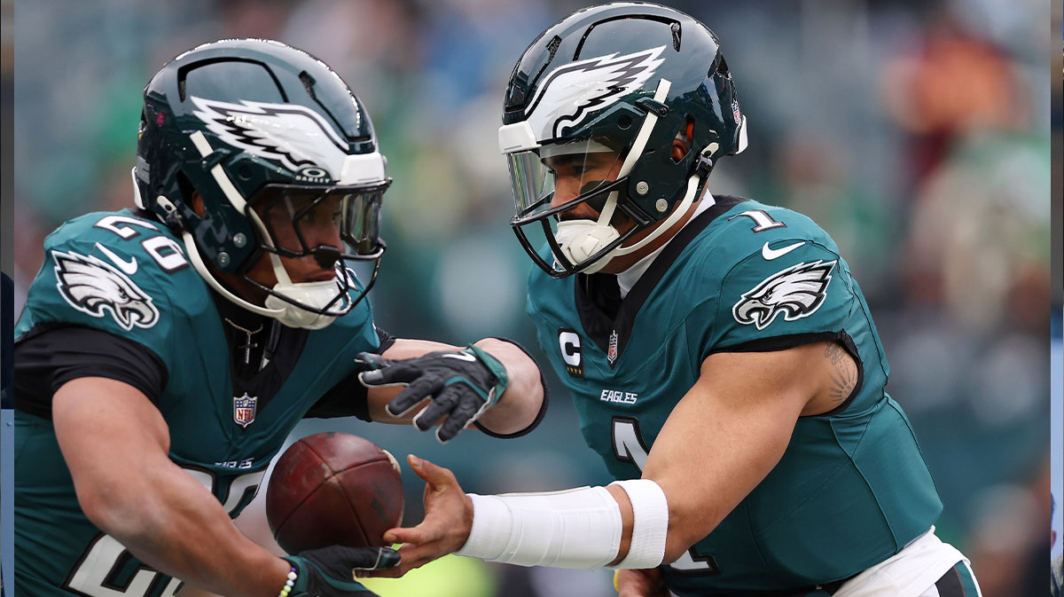 Philadelphia Eagles quarterback Jalen Hurts (1) and running back Saquon Barkley (26) warm up before the NFC Championship game at Lincoln Financial Field.