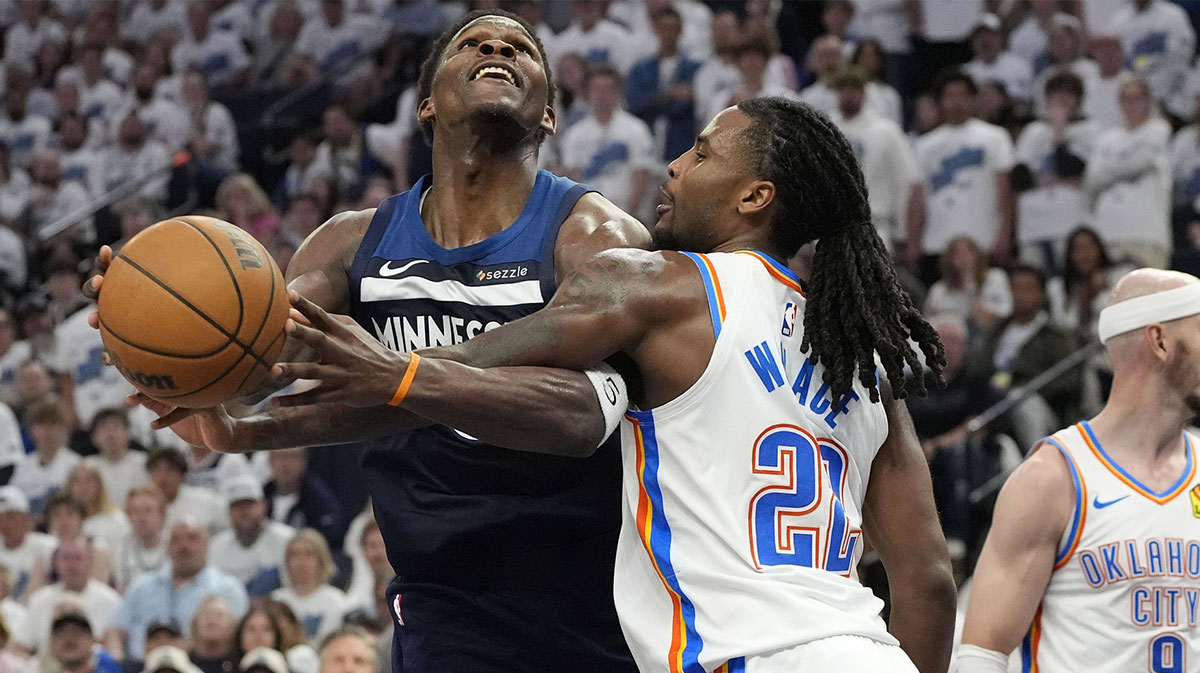 Minnesota Timberwolves guard Anthony Edwards (5) attempts to shoot the ball on Oklahoma City Thunder guard Cason Wallace (22) in the second half during game four of the western conference finals for the 2025 NBA Playoffs at Target Center.