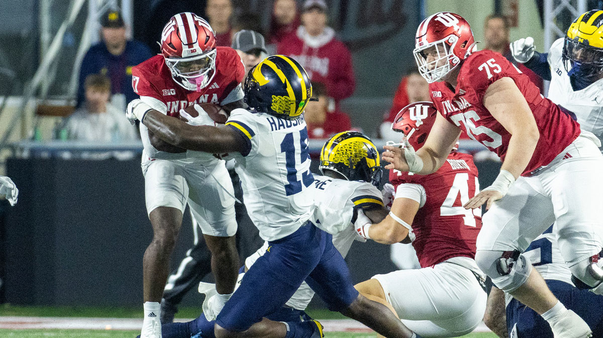 Indiana Hoosiers running back Ty Son Lawton (17) runs with the ball while Michigan Wolverines linebacker Ernest Hausmann (15) defends in the second half at Memorial Stadium.