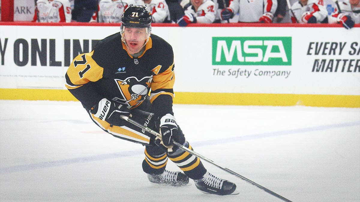 Pittsburgh Penguins center Evgeni Malkin (71) skates with the puck against the Washington Capitals during the second period at PPG Paints Arena.