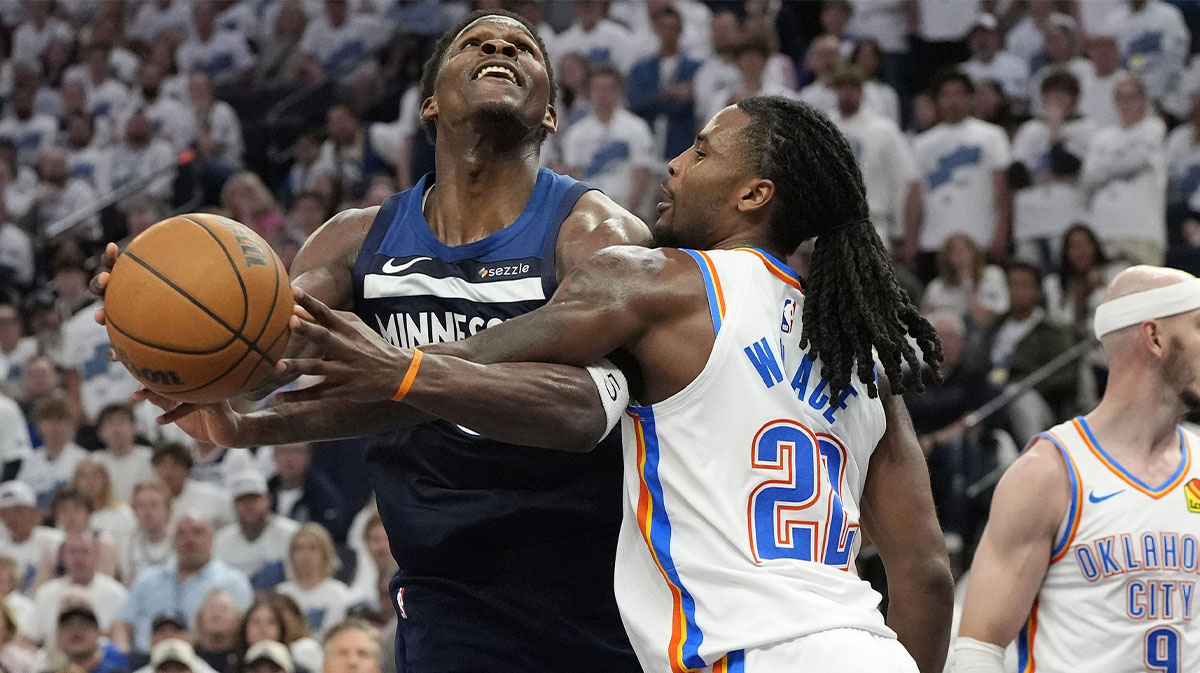 Minnesota Timberwolves guard Anthony Edwards (5) attempts to shoot the ball on Oklahoma City Thunder guard Cason Wallace (22) in the second half during game four of the western conference finals for the 2025 NBA Playoffs at Target Center.