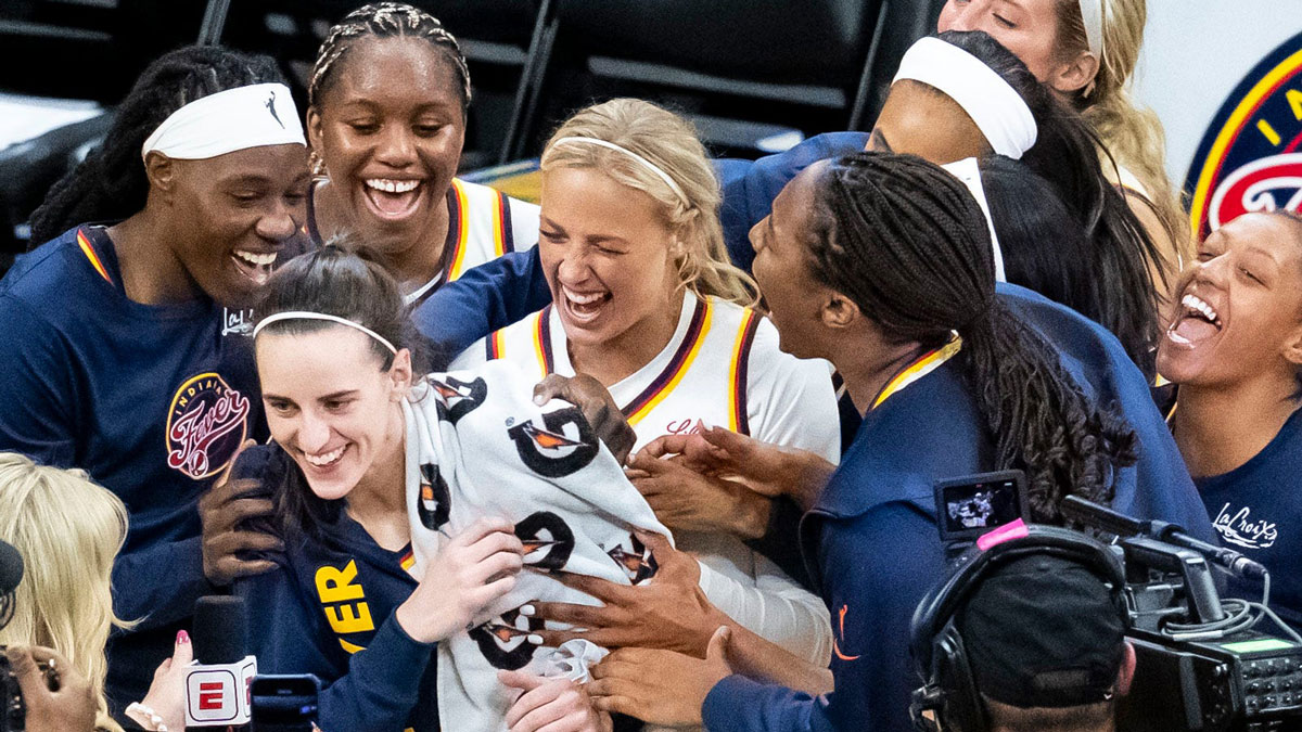 The Indiana Fever celebrate Indiana Fever guard Caitlin Clark (22) Sunday, May 4, 2025, during a preseason game between the Indiana Fever and the Brazil national team at Carver-Hawkeye Arena in Iowa City. The Indiana Fever defeated the Brazilian National Team, 108-44.