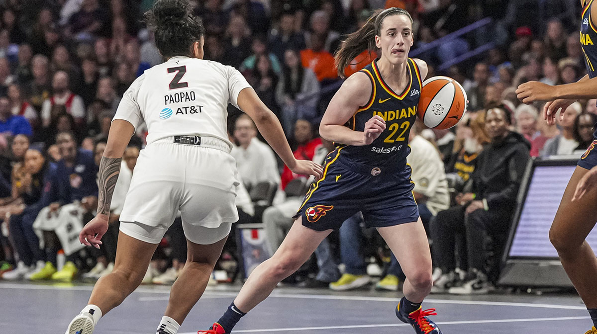Indiana Fever guard Caitlin Clark (22) dribbles against Atlanta Dream guard Te-Hina Paopao (2) during the second half at Gateway Center Arena @ College Park.