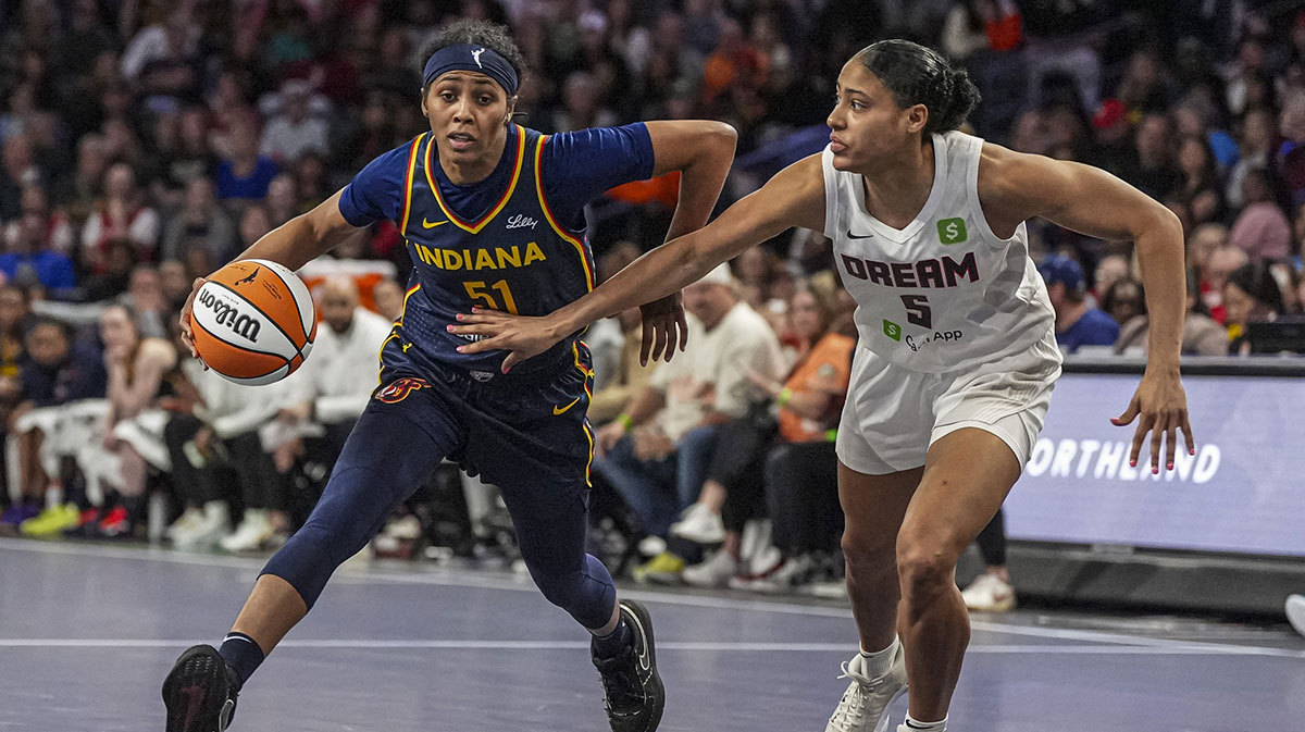 Indiana Fever guard Sydney Colson (51) drives against Atlanta Dream forward Taylor Thierry (5) during the second half at Gateway Center Arena @ College Park.