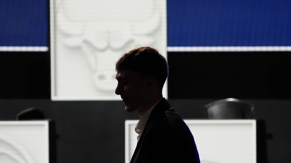 Cooper Flagg walks to his seat during the 2025 NBA Draft Lottery at McCormick Place.