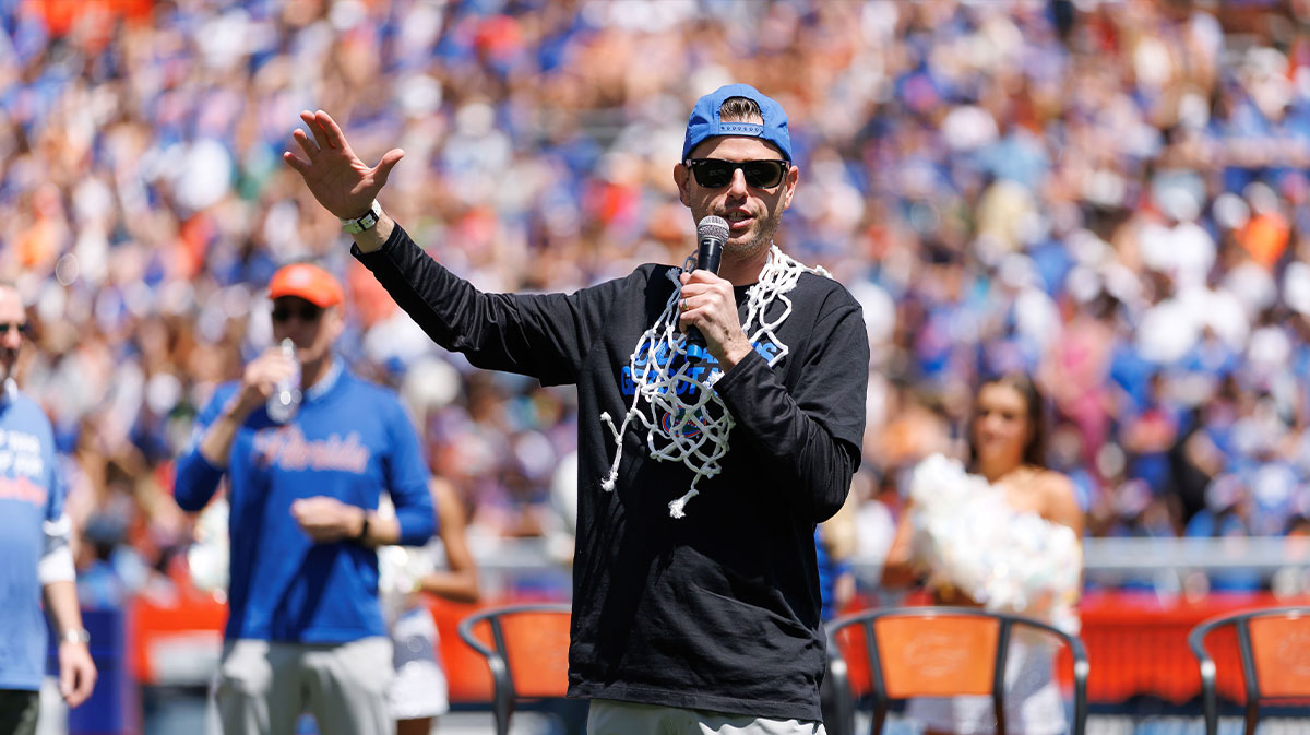 Florida Gators head coach Todd Golden gestures while speaking to the crowd during the National Championship celebration at Ben Hill Griffin Stadium.