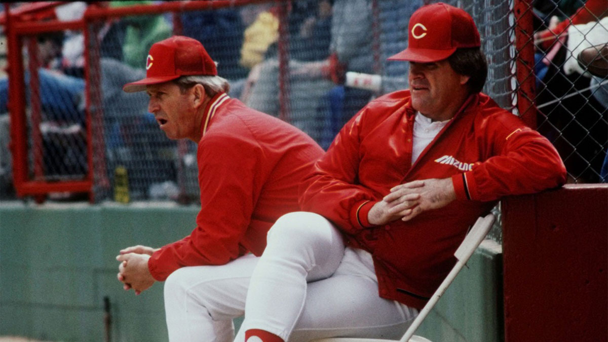 Cincinnati Reds manager Pete Rose, right, and coach Tommy Helms watching the action in their exhibition game against Toronto during their spring training camp in Tampa, Florida on March 31, 1987.
