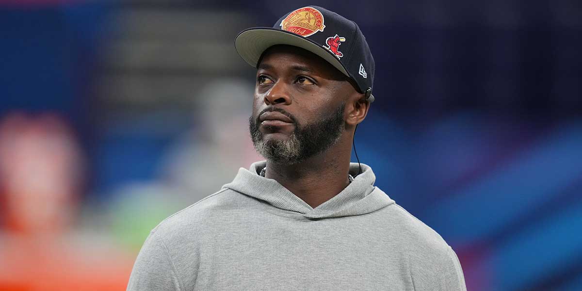Former NFL player Reggie Wayne looks on during the 2025 NFL Combine at Lucas Oil Stadium.
