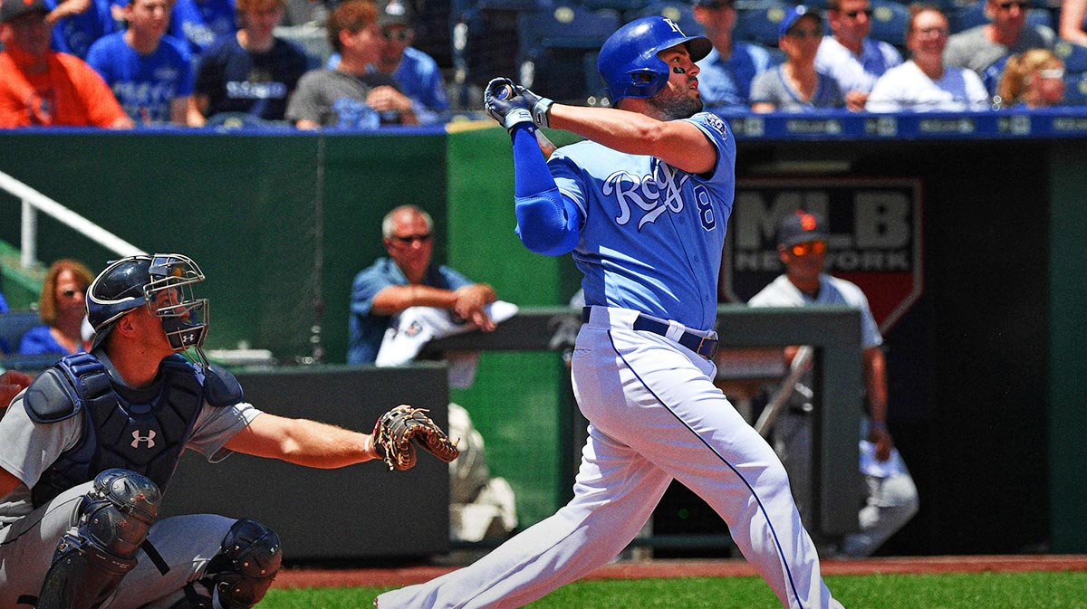 Kansas City Royals third baseman Mike Moustakas (8) singles during the first inning against the Detroit Tigers at Kauffman Stadium.