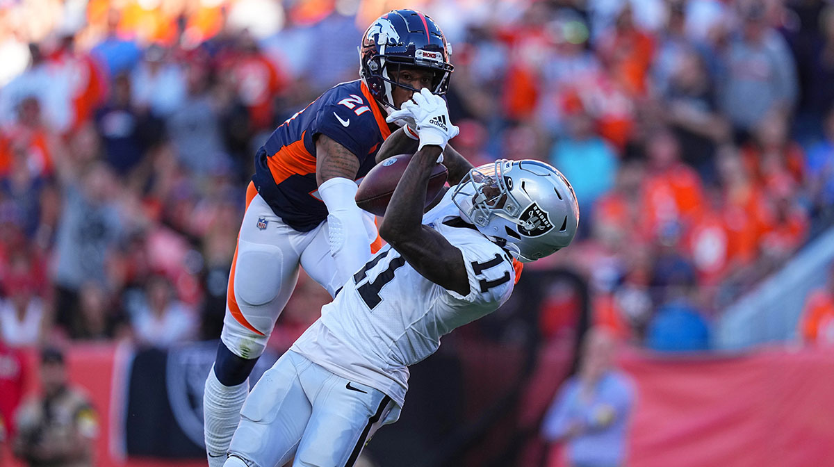 Las Vegas Raiders wide receiver Henry Ruggs III (11) pulls in a reception past Denver Broncos cornerback Ronald Darby (21) in the second half at Empower Field at Mile High.