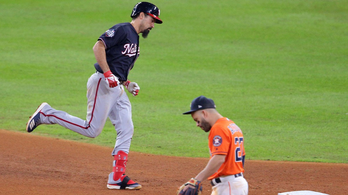 Washington Nationals third baseman Anthony Rendon (6) rounds the bases past Houston Astros second baseman Jose Altuve (27) after a solo home run during the seventh inning in game seven of the 2019 World Series at Minute Maid Park.