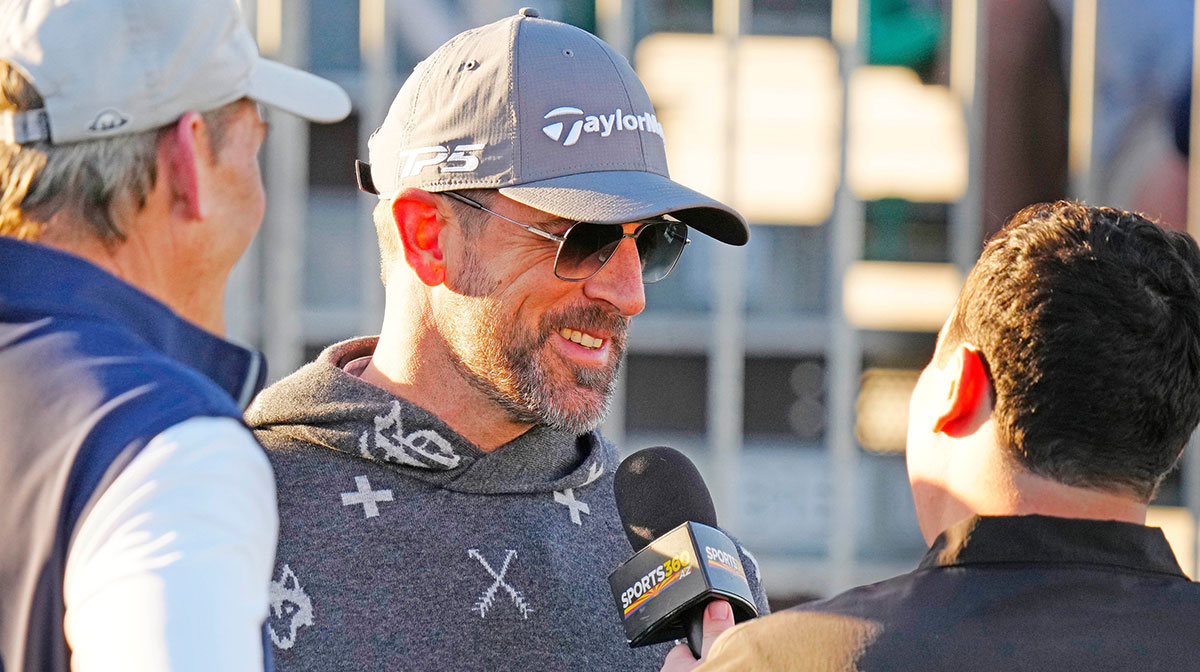 FeJets quarterback Aaron Rodgers talks with the press on the first tee box during the Phoenix Open Annexus Pro-Am at TPC Scottsdale.