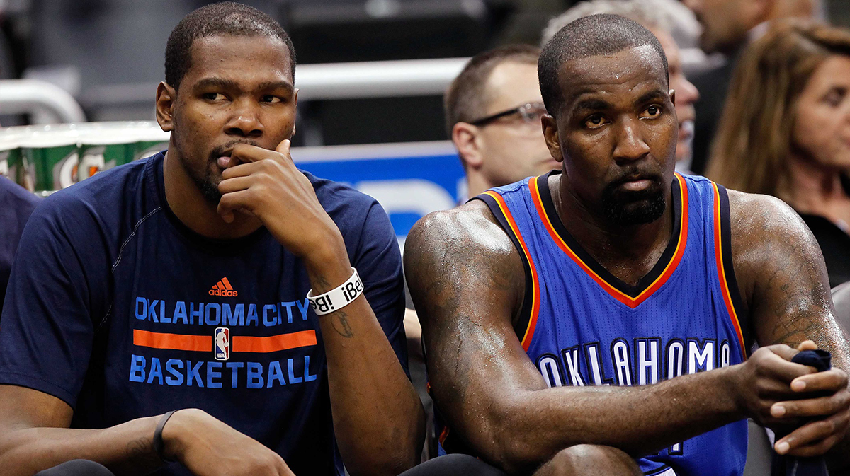 Thunder forward Kevin Durant (35) and center Kendrick Perkins (5) look on from the bench against the Orlando Magic during the second half at Amway Center. Oklahoma City Thunder defeated the Orlando Magic 127-99
