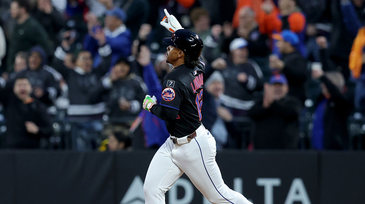 New York Mets shortstop Francisco Lindor (12) reacts as he rounds the bases after hitting a solo home run against the Chicago Cubs.