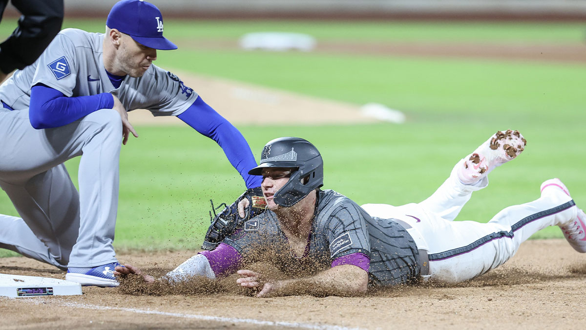 New York Mets first baseman Pete Alonso (20) is tagged out by Los Angeles Dodgers first baseman Freddie Freeman (5) on a pick off play in the seventh inning at Citi Field.